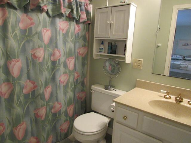 12 Yearling Run Road Buzzards Bay, MA 02532 - Photo 17 of 36 a bathroom with a granite countertop toilet sink and mirror