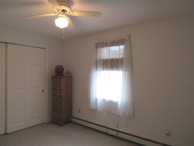 12 Yearling Run Road Buzzards Bay, MA 02532 - Photo 23 of 36 an empty room with windows and fan
