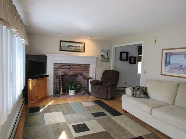 12 Yearling Run Road Buzzards Bay, MA 02532 - Photo 6 of 36 a living room with furniture and a fireplace