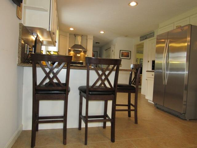 12 Yearling Run Road Buzzards Bay, MA 02532 - Photo 8 of 36 a kitchen with a table chairs refrigerator and microwave