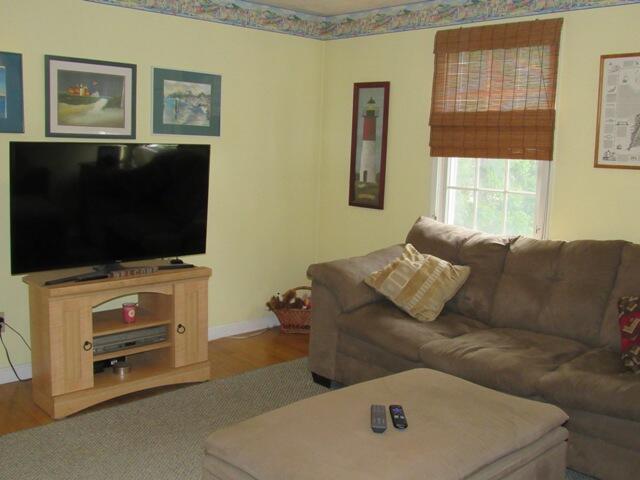 12 Yearling Run Road Buzzards Bay, MA 02532 - Photo 10 of 36 a living room with furniture and a flat screen tv