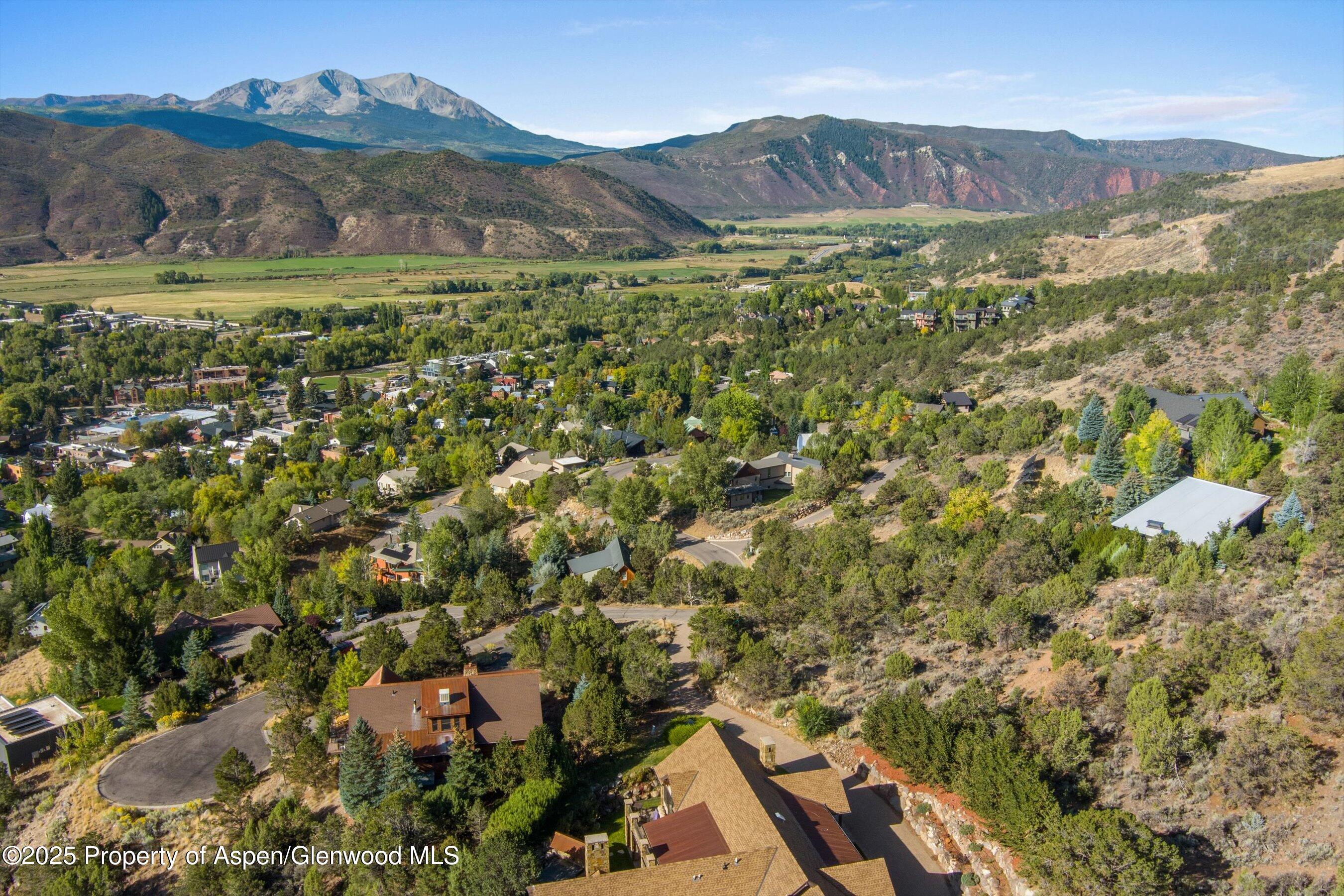 204 Ridge Road Basalt, CO 81621 - Photo 12 of 12 a view of a lush green hillside and houses