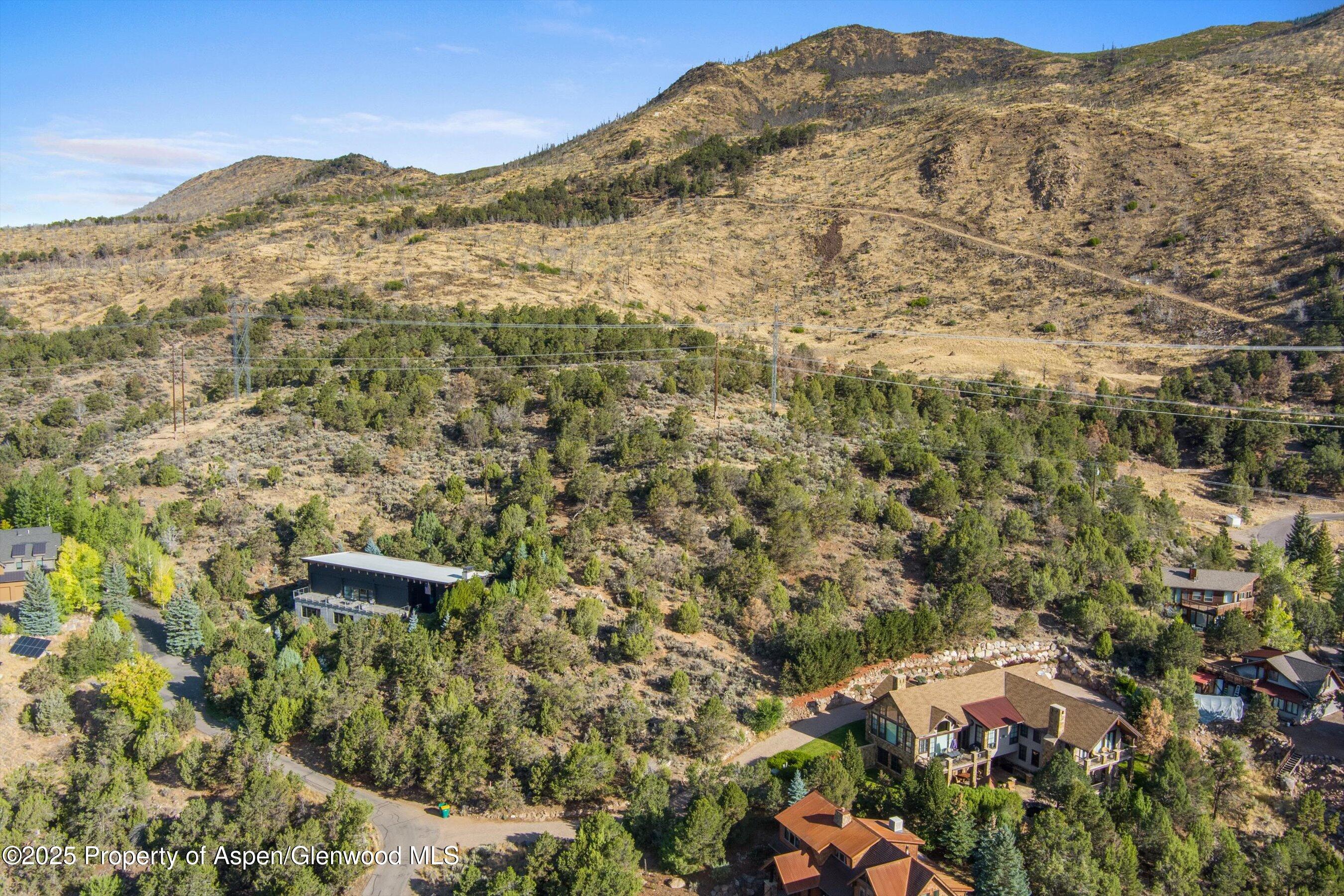 204 Ridge Road Basalt, CO 81621 - Photo 6 of 12 a view of a dry yard with mountains in the background