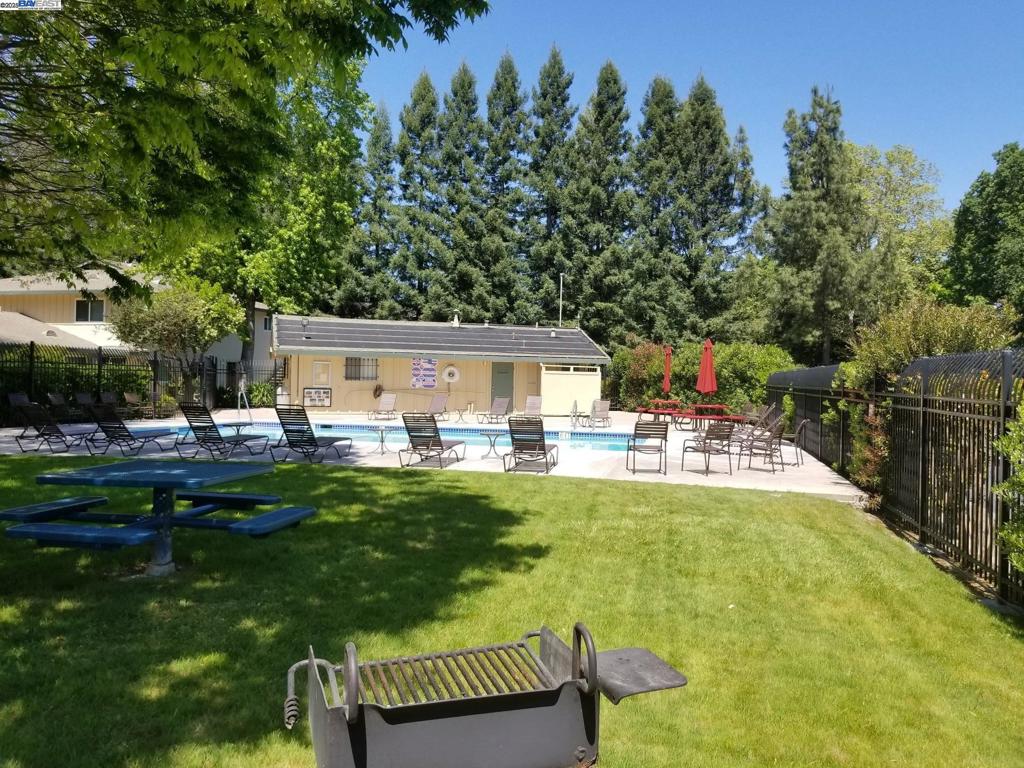 Undisclosed Address Pleasanton, CA 94588 - Photo 17 of 17 a view of backyard with swimming pool and patio