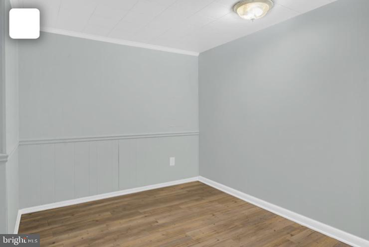 6701 Furman Parkway Riverdale, MD 20737 - Photo 4 of 9 a view of a room with wooden floor