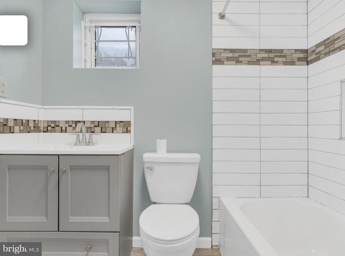 6701 Furman Parkway Riverdale, MD 20737 - Photo 5 of 9 a bathroom with a toilet and a sink