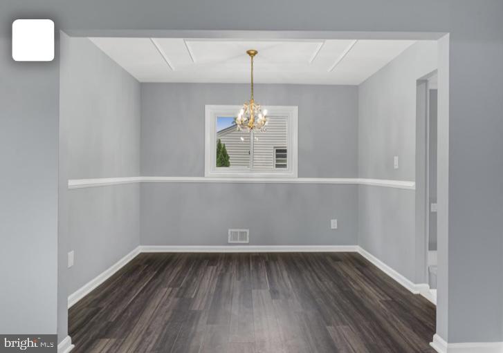 6701 Furman Parkway Riverdale, MD 20737 - Photo 9 of 9 a view of an empty room with wooden floor and a window