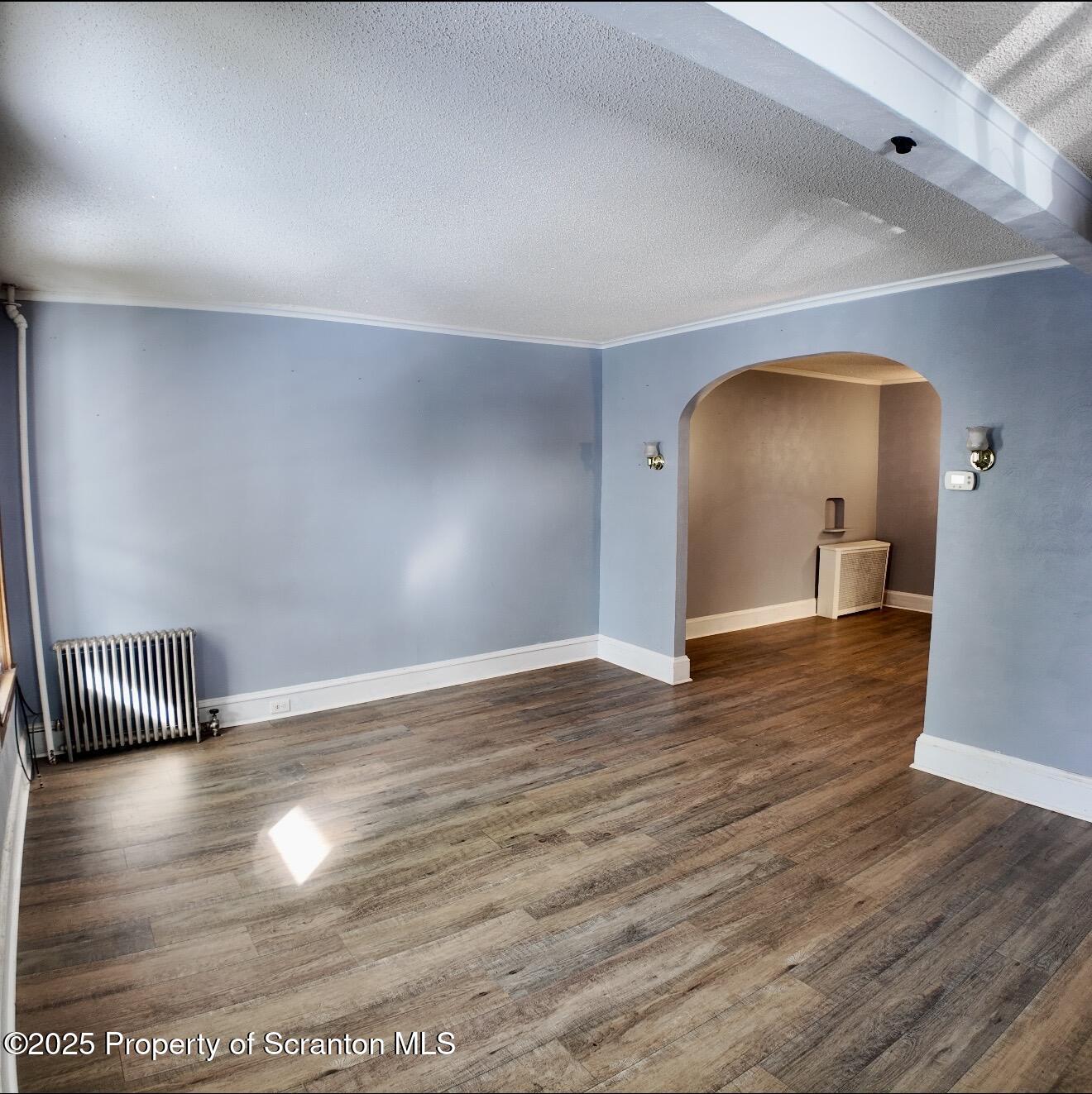 58 Owego Street Simpson, PA 18407 - Photo 9 of 16 a view of empty room with wooden floor