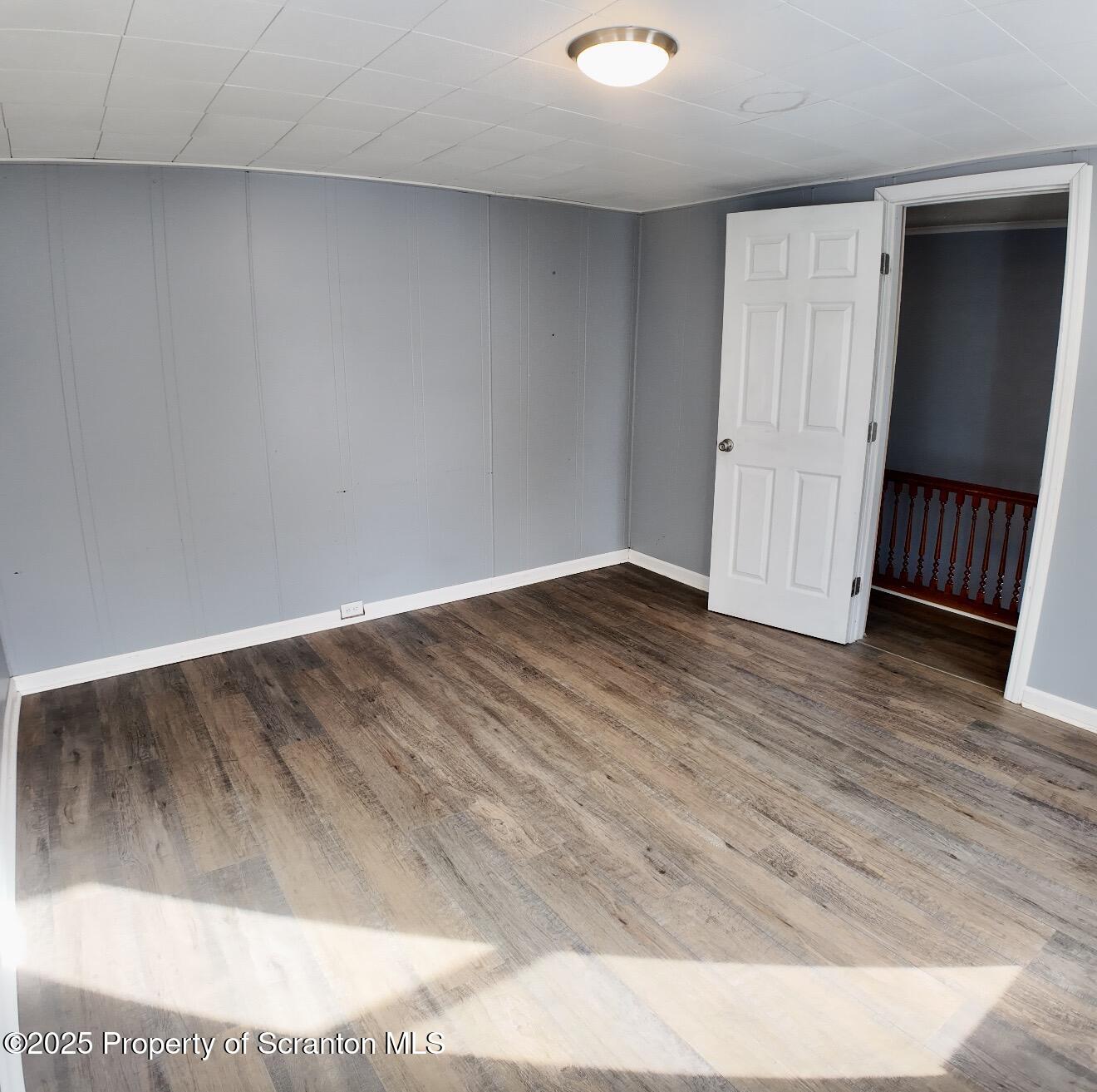 58 Owego Street Simpson, PA 18407 - Photo 10 of 16 a view of a room with wooden floor