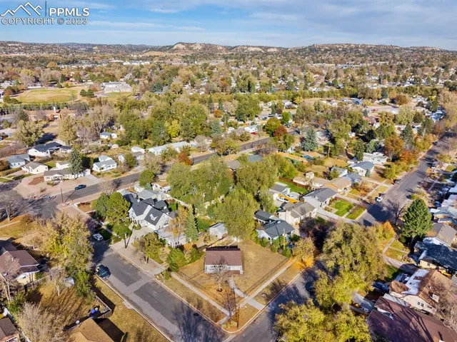a view of a city with mountains in the background