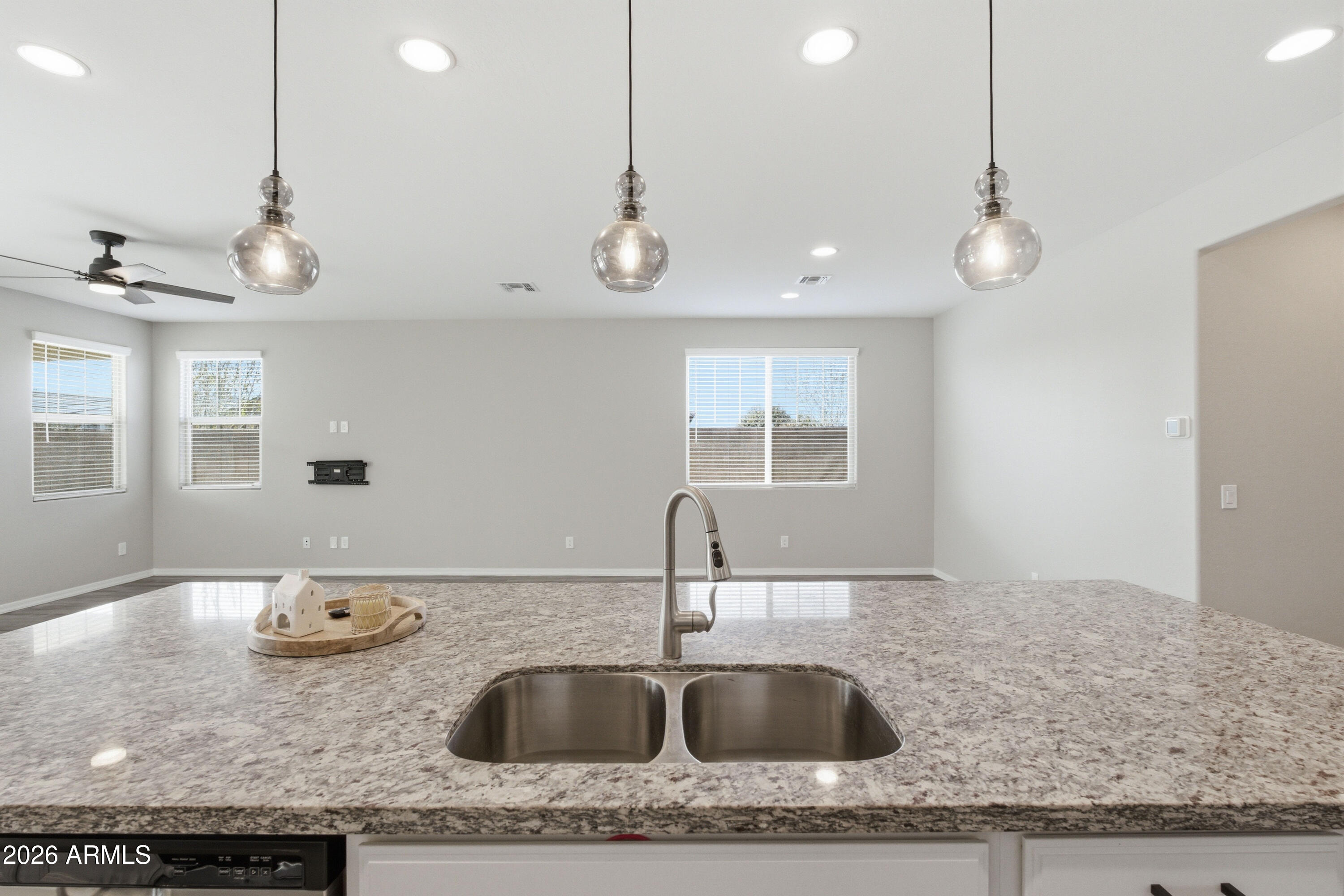 22445 East Marsh Road Queen Creek, AZ 85142 - Photo 29 of 71 a kitchen with a sink a counter space appliances and cabinets