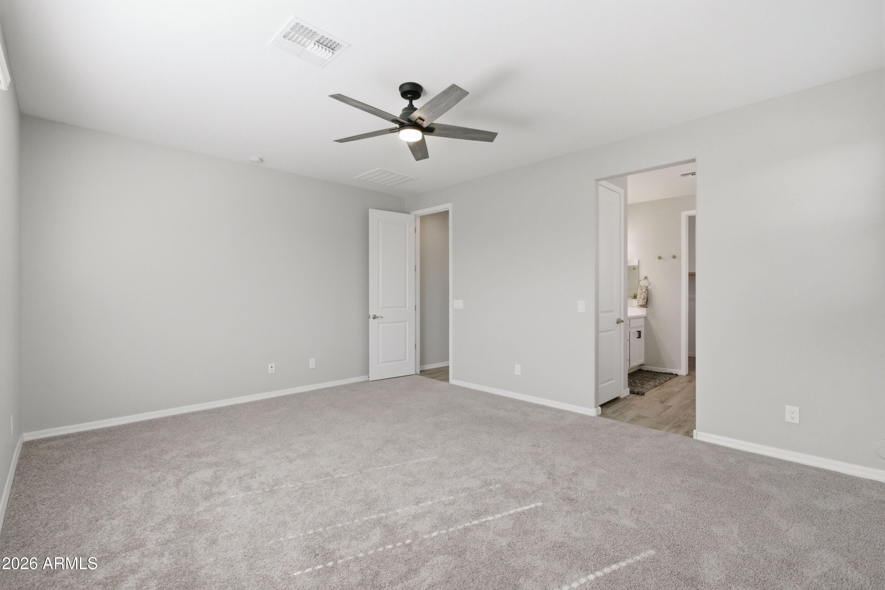 22445 East Marsh Road Queen Creek, AZ 85142 - Photo 36 of 71 a view of an empty room with a ceiling fan