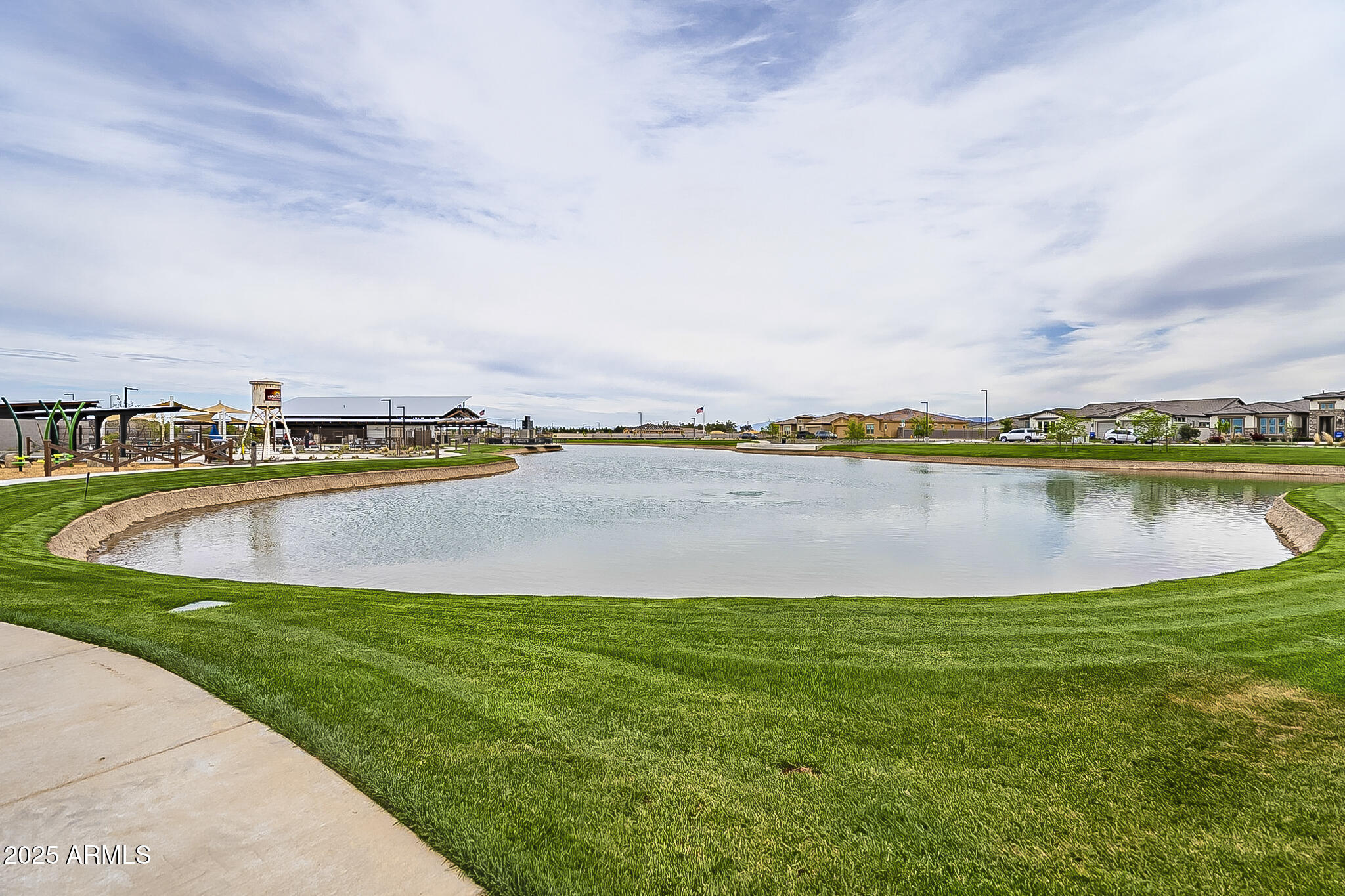 22445 East Marsh Road Queen Creek, AZ 85142 - Photo 70 of 71 a view of a lake with houses in the back