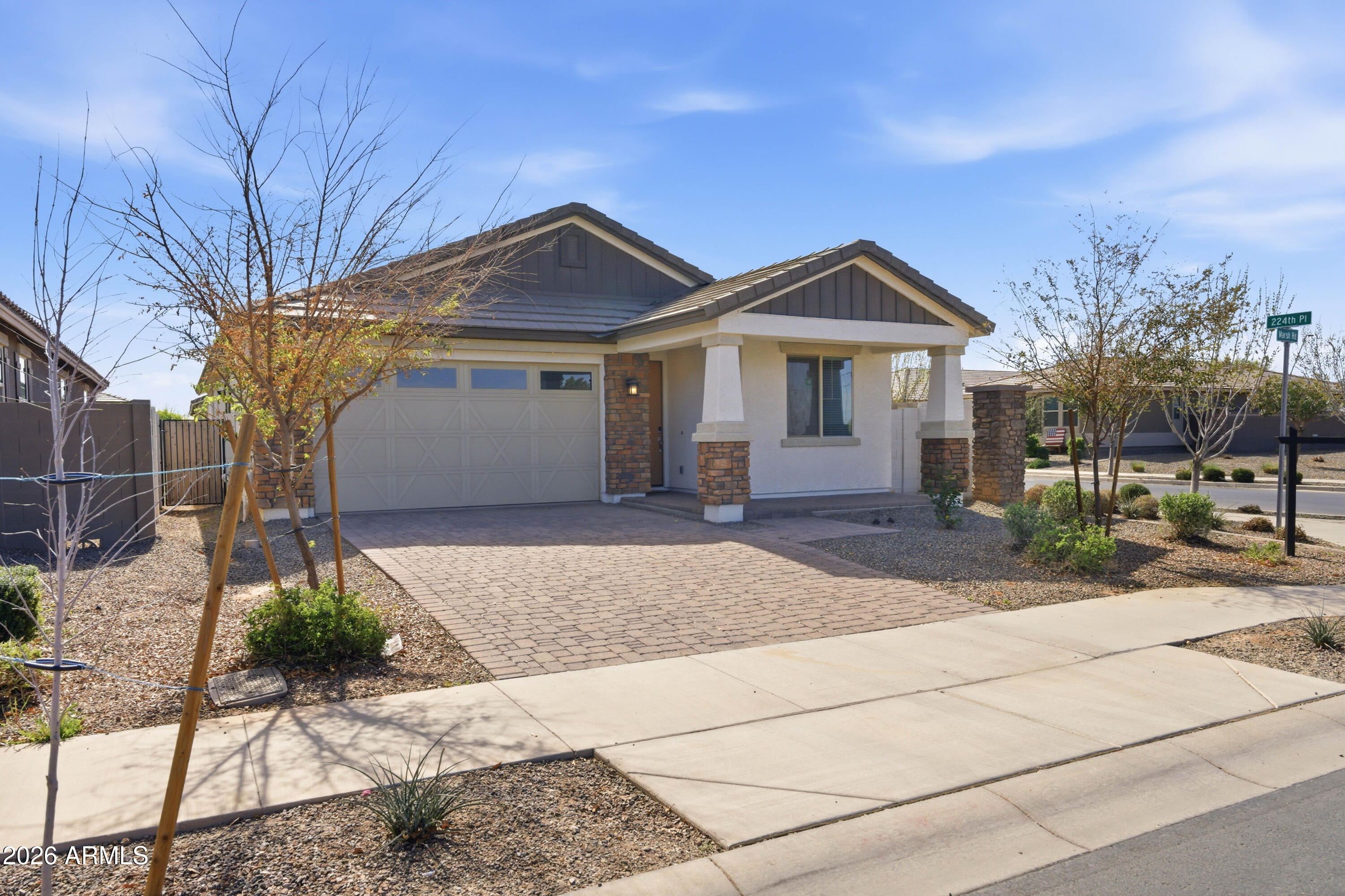 22445 East Marsh Road Queen Creek, AZ 85142 - Photo 71 of 71 a front view of a house with a yard and garage