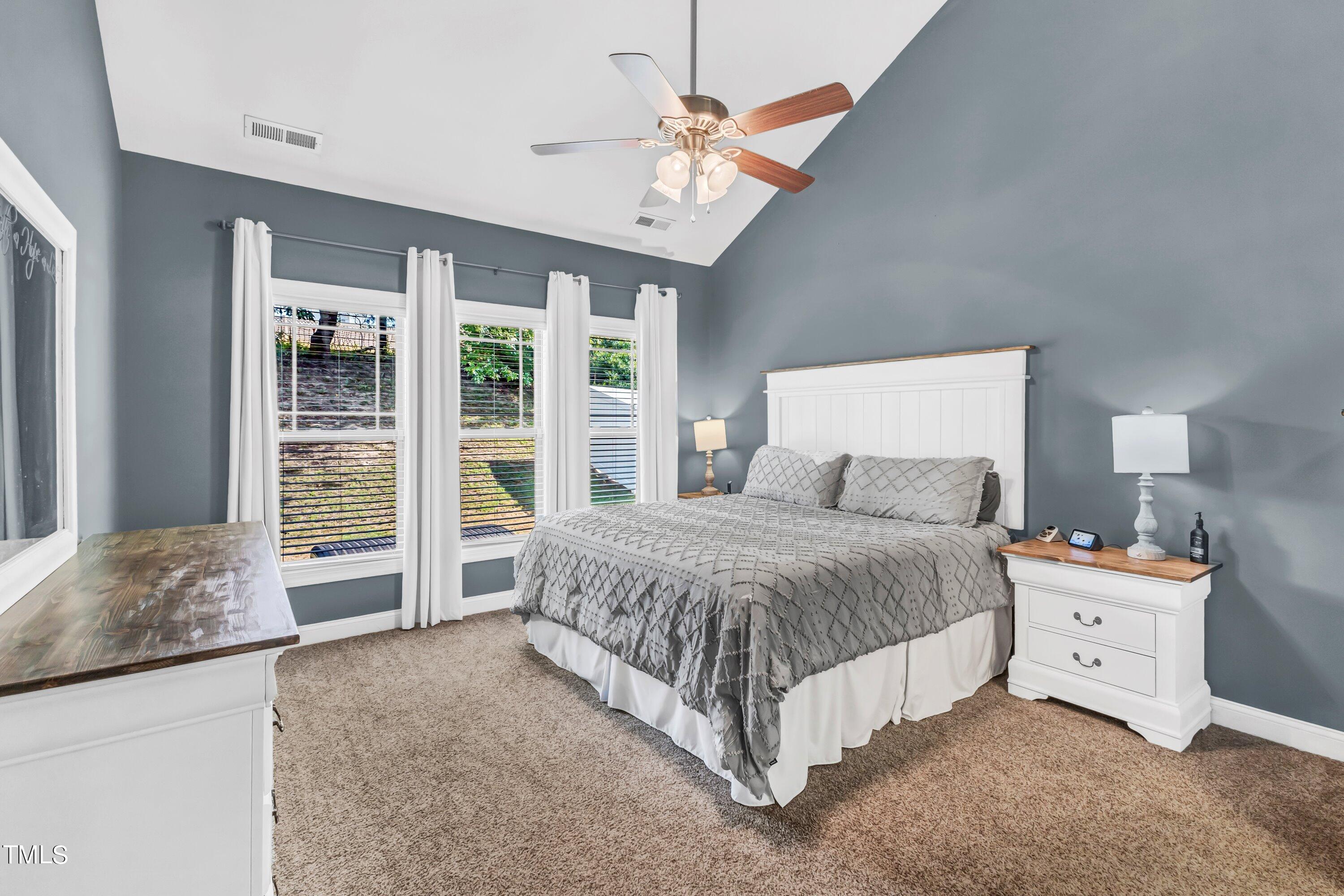 4151 White Kestrel Drive Raleigh, NC 27616 - Photo 16 of 37 a spacious bedroom with a bed and a large window
