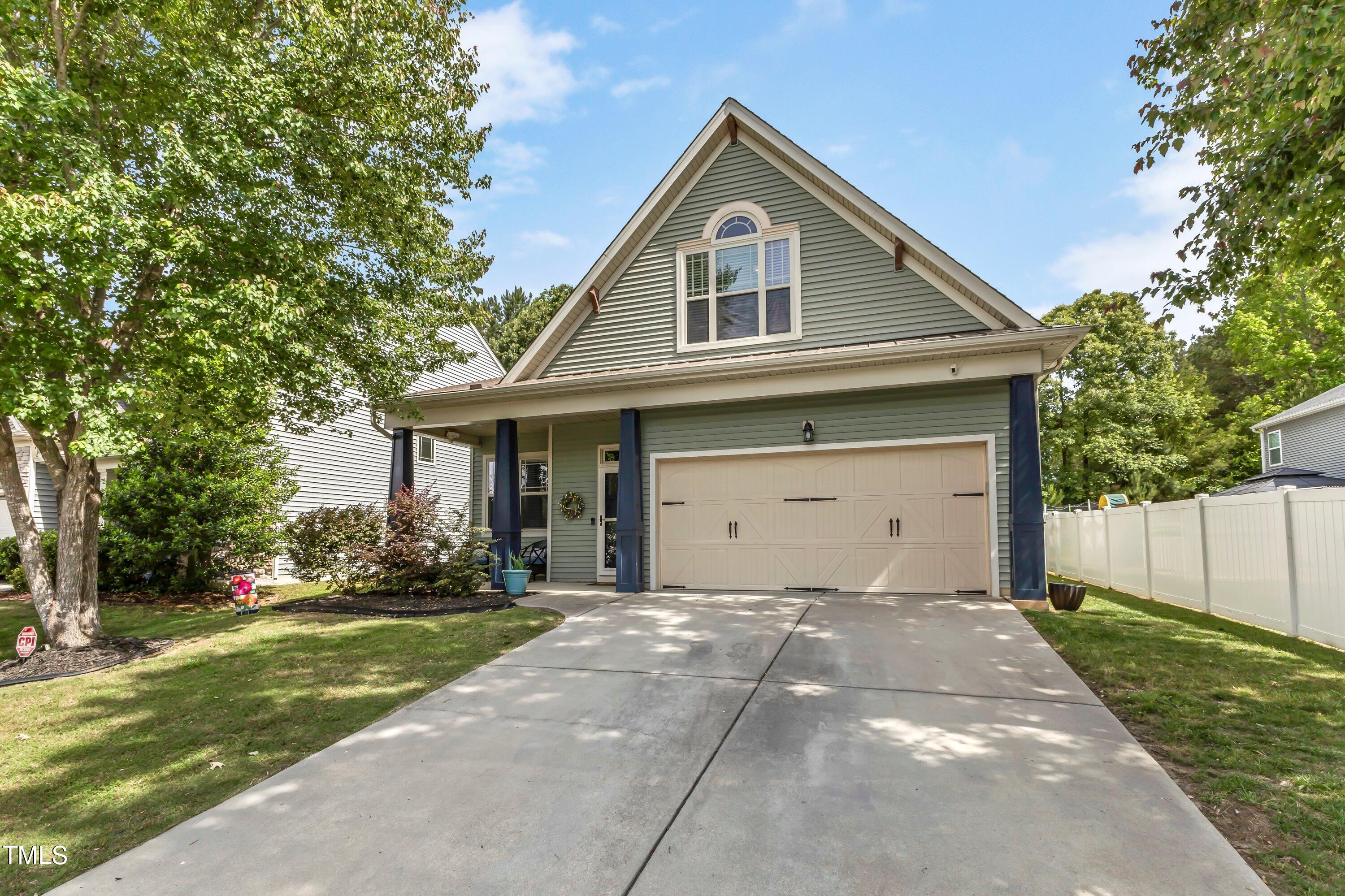 4151 White Kestrel Drive Raleigh, NC 27616 - Photo 2 of 37 a front view of a house with a yard