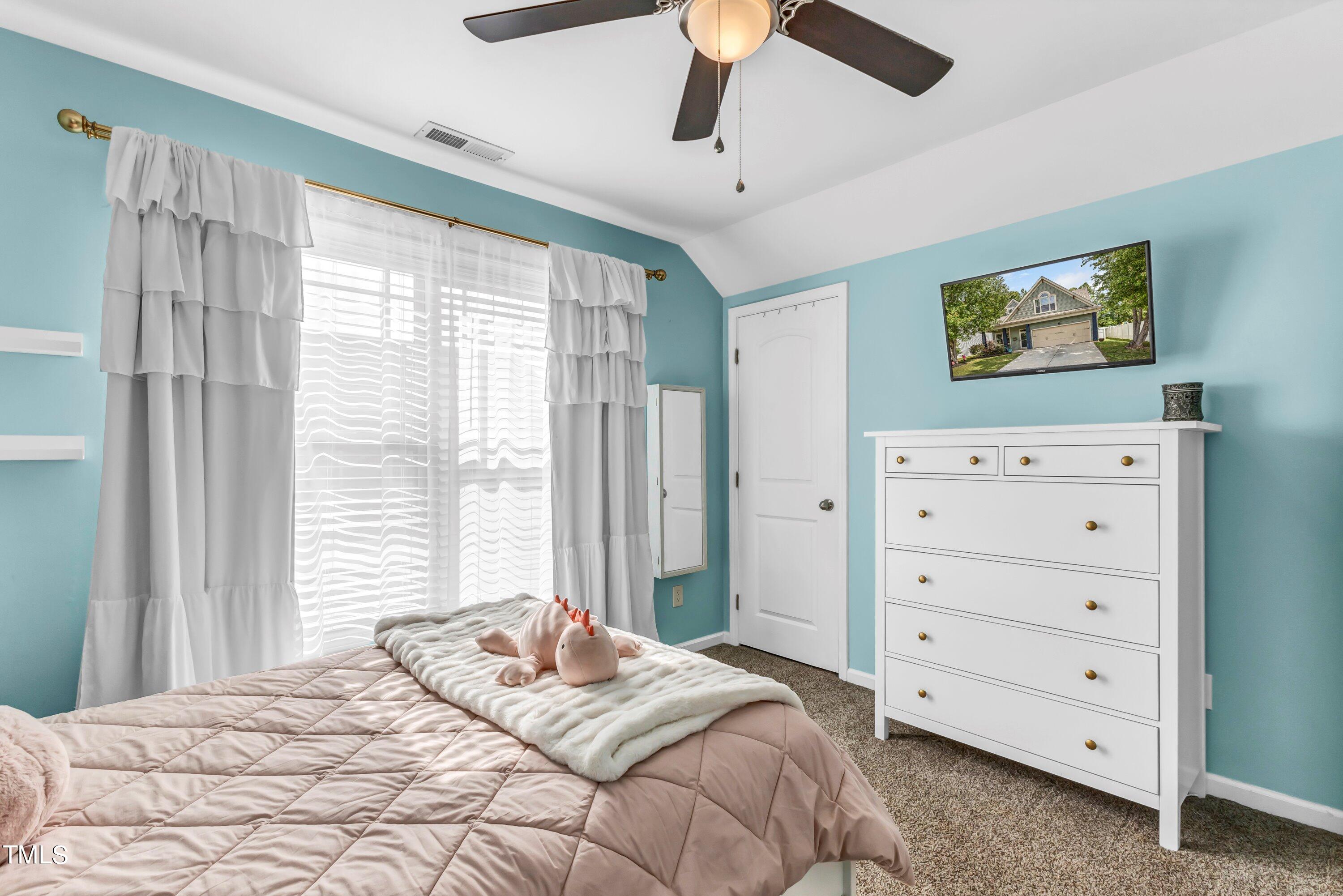 4151 White Kestrel Drive Raleigh, NC 27616 - Photo 27 of 37 a bedroom with a bed and a dresser