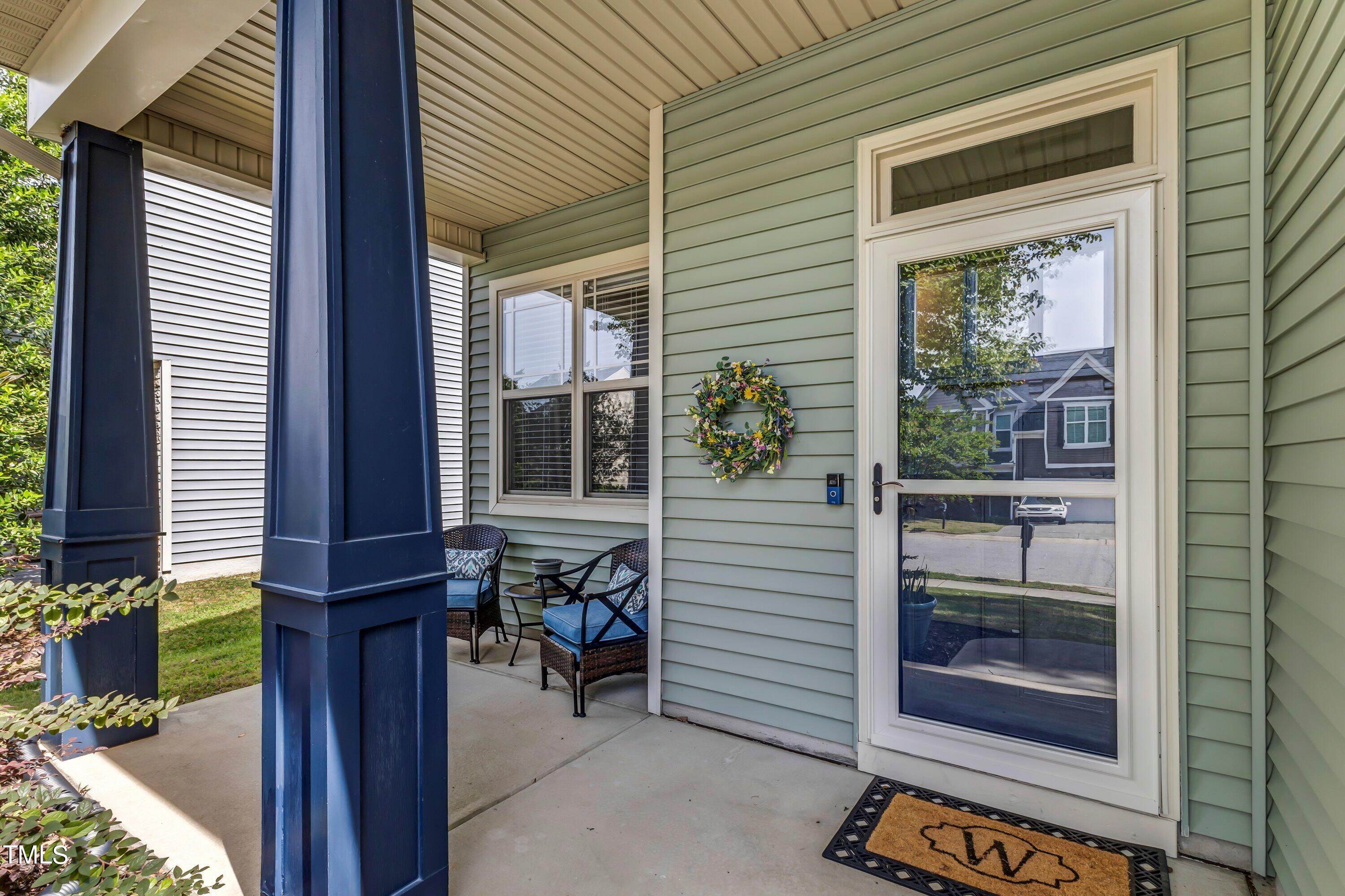 4151 White Kestrel Drive Raleigh, NC 27616 - Photo 3 of 37 a view of a porch with a door and a chair