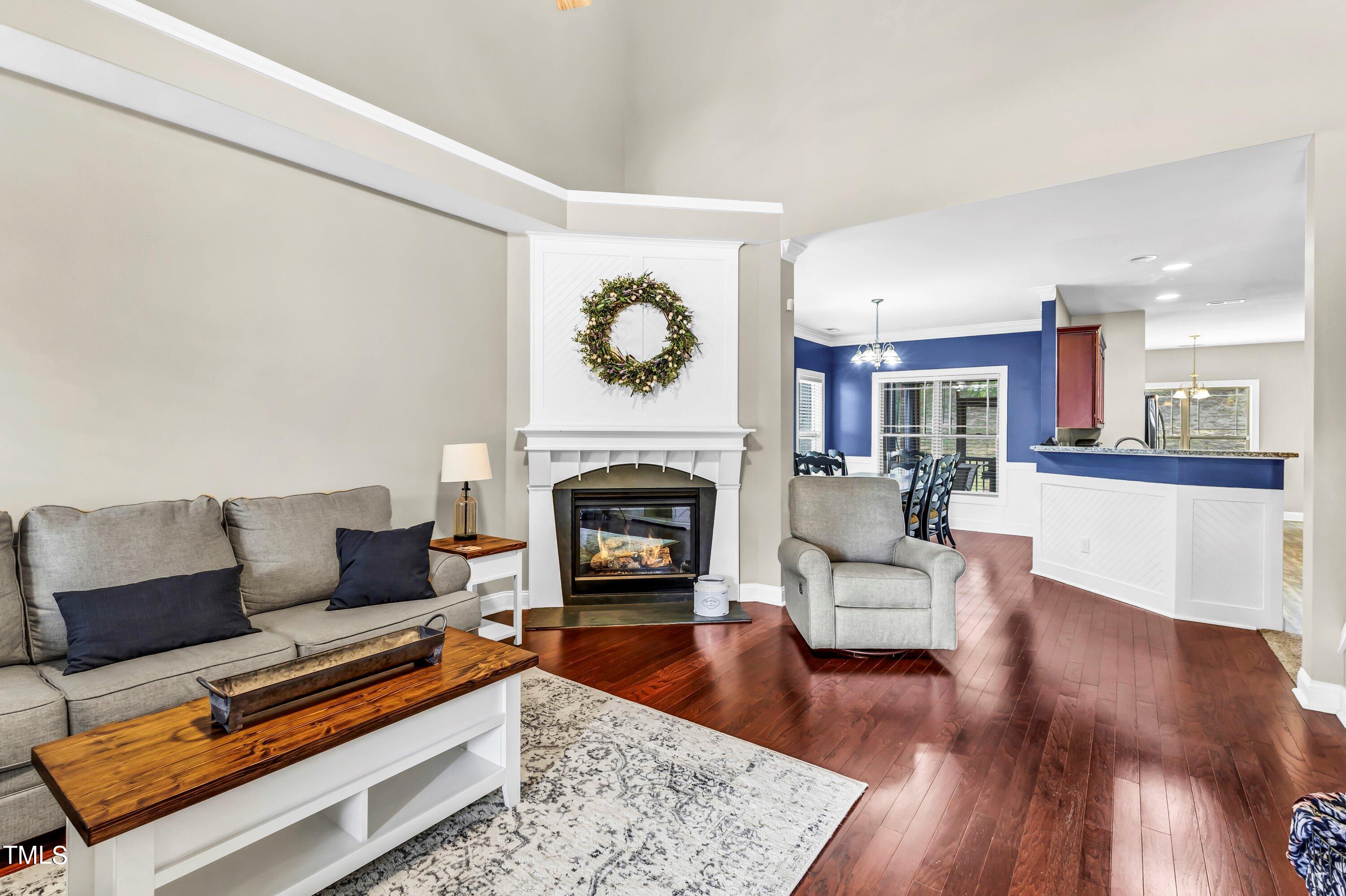 4151 White Kestrel Drive Raleigh, NC 27616 - Photo 6 of 37 a living room with furniture and a fireplace