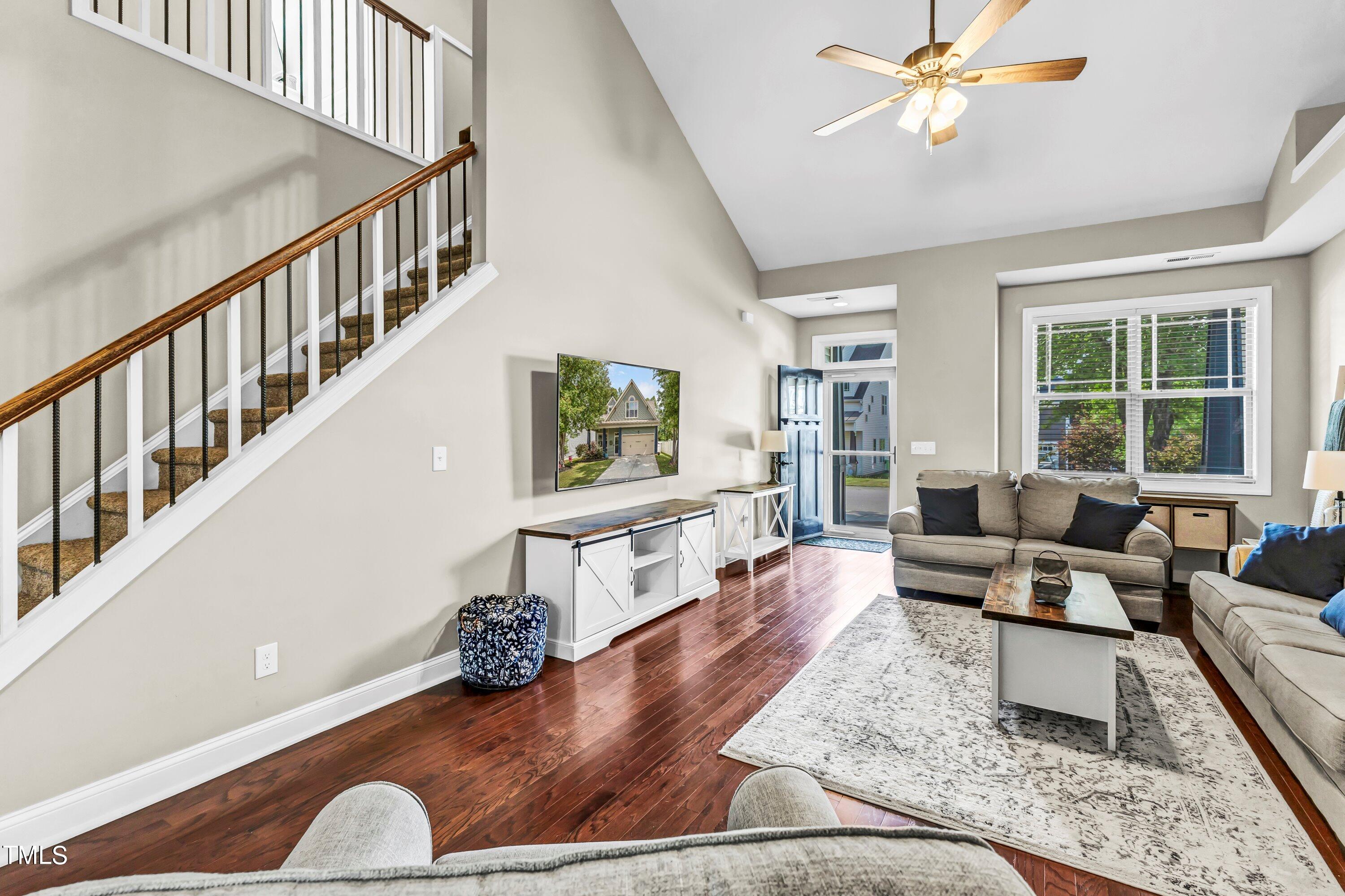 4151 White Kestrel Drive Raleigh, NC 27616 - Photo 8 of 37 a living room with furniture or couch and a dining table
