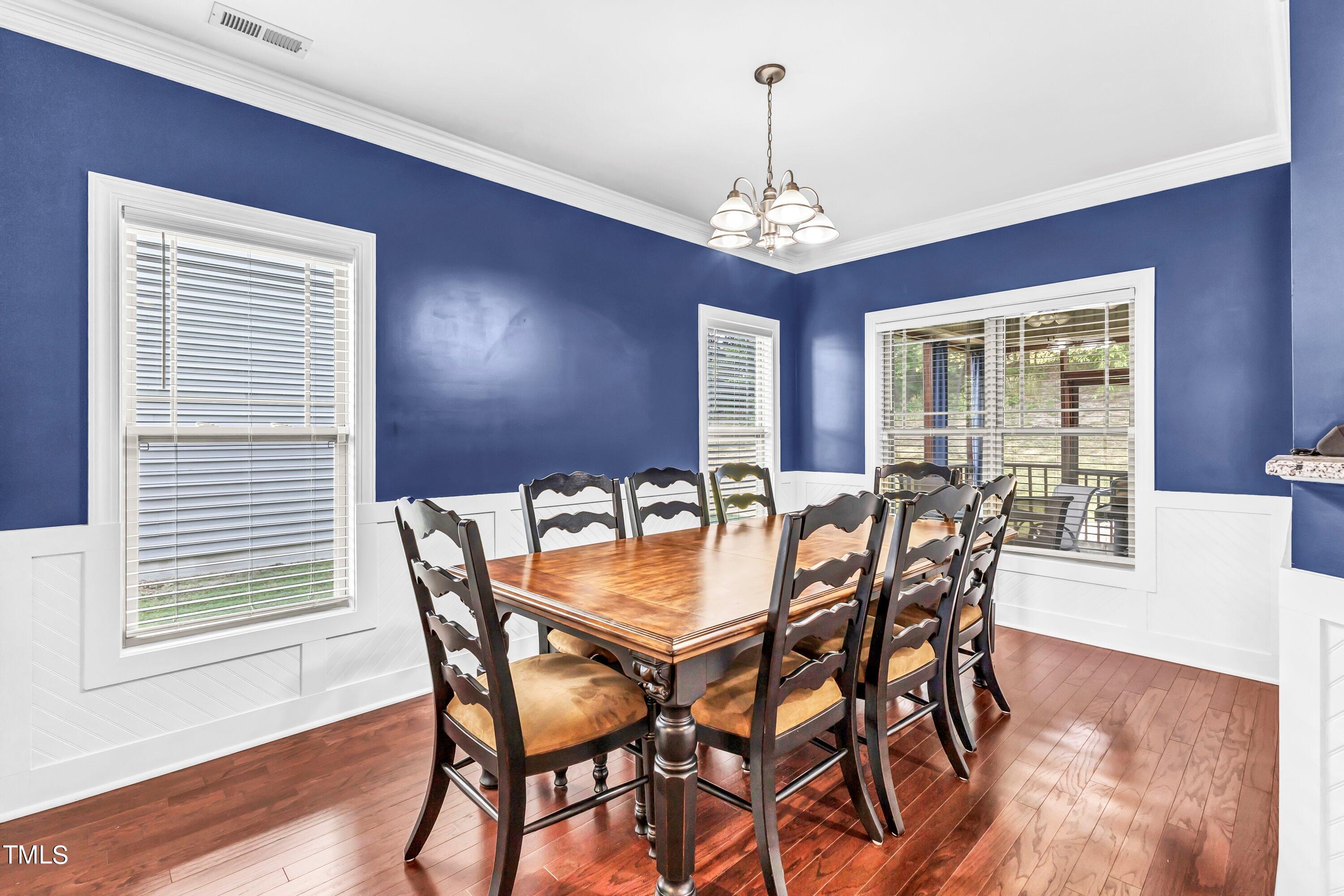 4151 White Kestrel Drive Raleigh, NC 27616 - Photo 9 of 37 a view of a dining room with furniture window and wooden floor