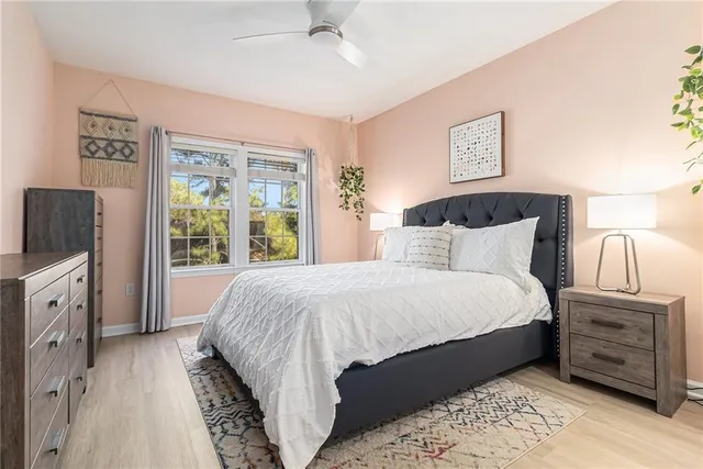 a bedroom with a bed and a tv on a dresser