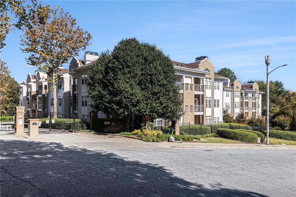 220 Renaissance Parkway Northeast, Unit 1211 Atlanta, GA 30308 - Photo 2 of 24 a view of a building with a street