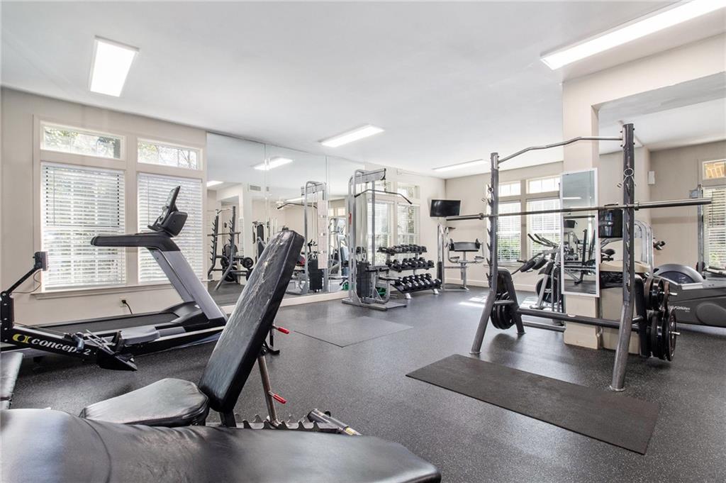 220 Renaissance Parkway Northeast, Unit 1211 Atlanta, GA 30308 - Photo 21 of 24 a view of a room with gym equipment