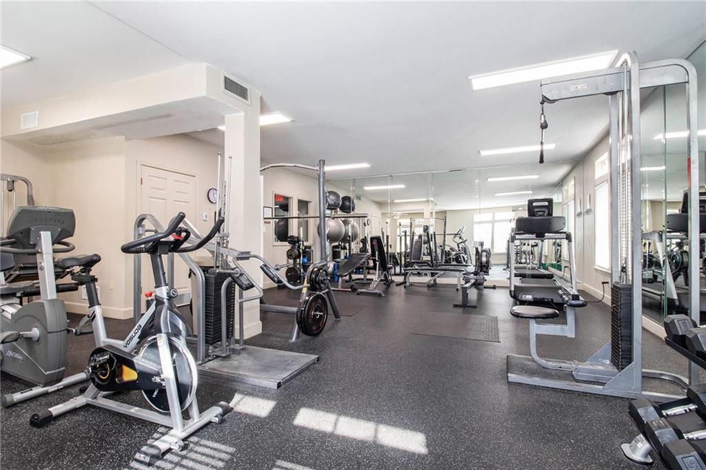 220 Renaissance Parkway Northeast, Unit 1211 Atlanta, GA 30308 - Photo 22 of 24 a view of a room with gym equipment