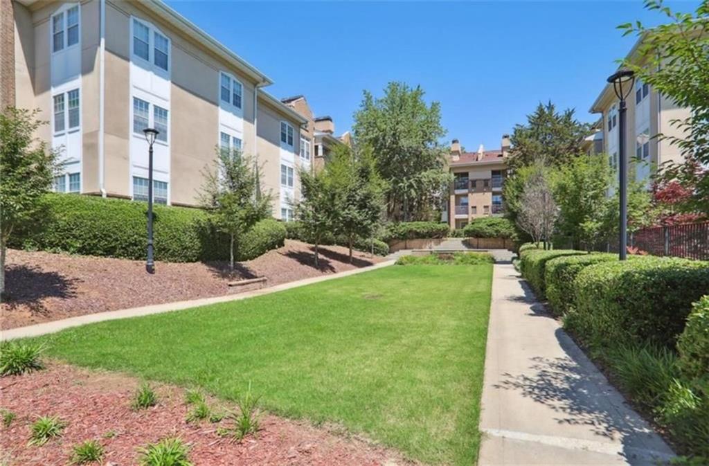220 Renaissance Parkway Northeast, Unit 1211 Atlanta, GA 30308 - Photo 5 of 24 a view of a back yard of the house