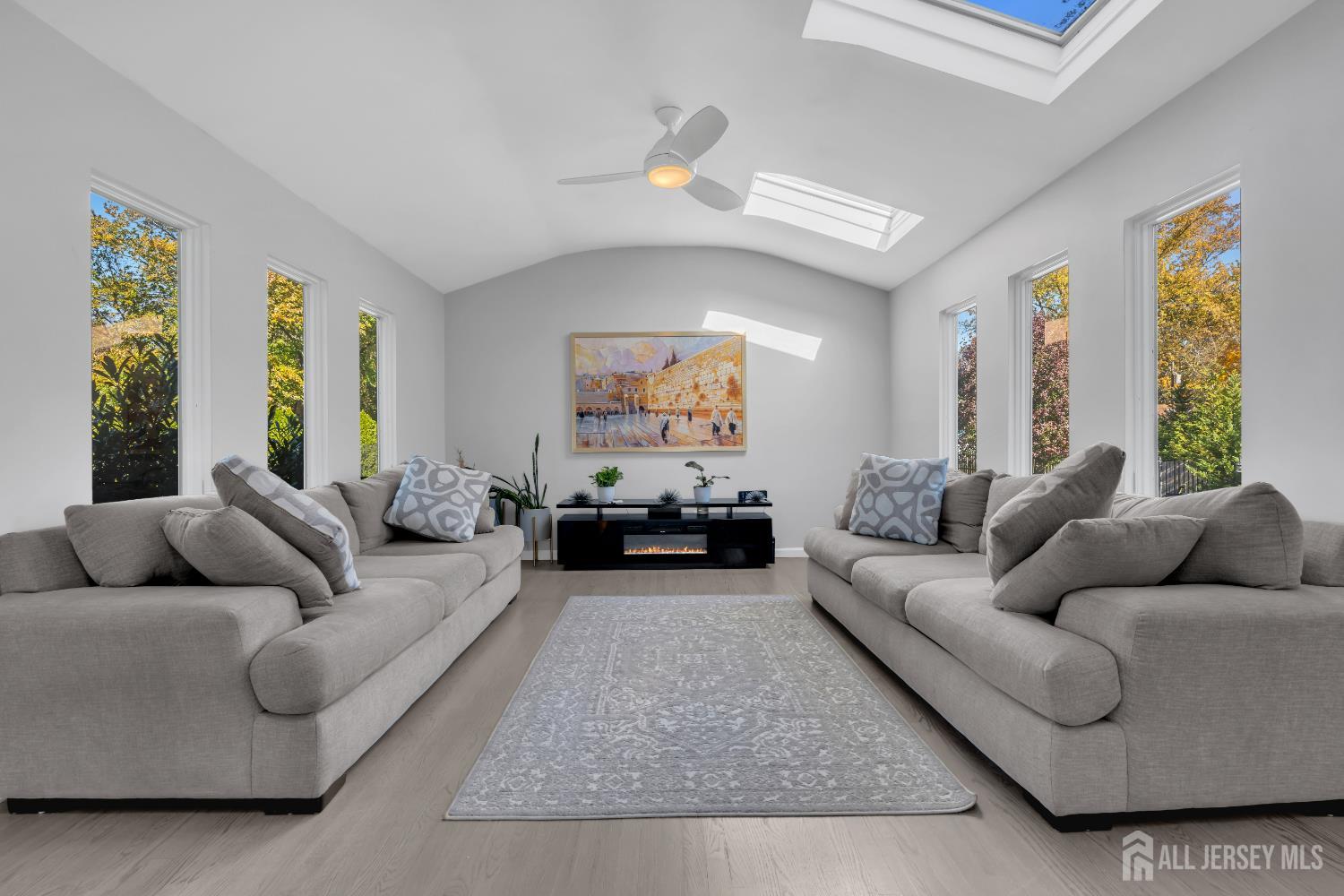 4 Canadian Woods Road Marlboro, NJ 07746 - Photo 16 of 45 a living room with furniture and a large window