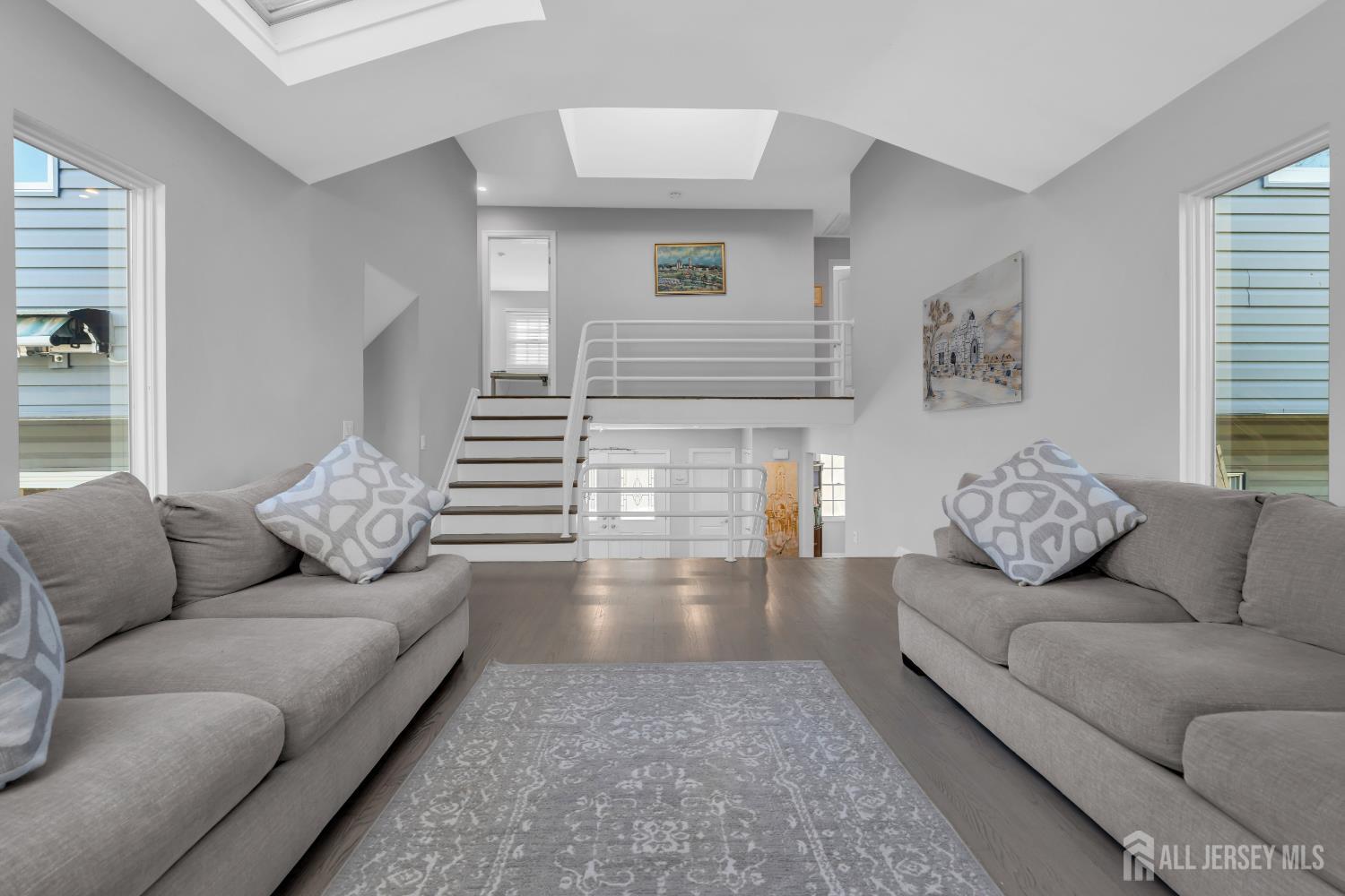 4 Canadian Woods Road Marlboro, NJ 07746 - Photo 17 of 45 a living room with furniture and a couch