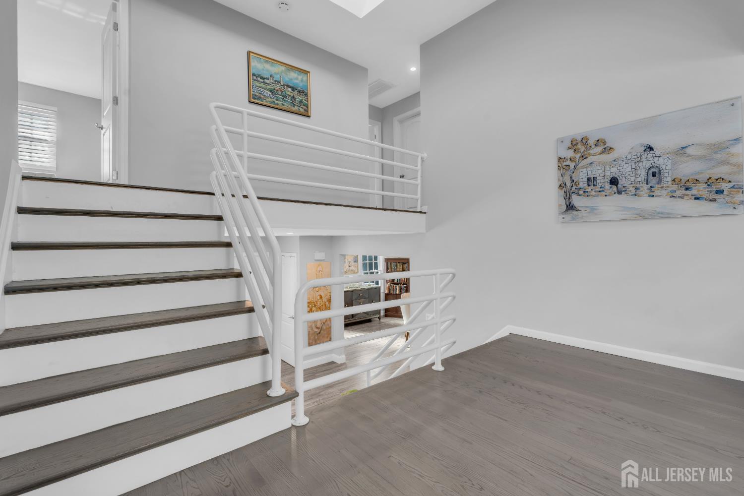 4 Canadian Woods Road Marlboro, NJ 07746 - Photo 21 of 45 a view of an empty room with stairs and a cabinet