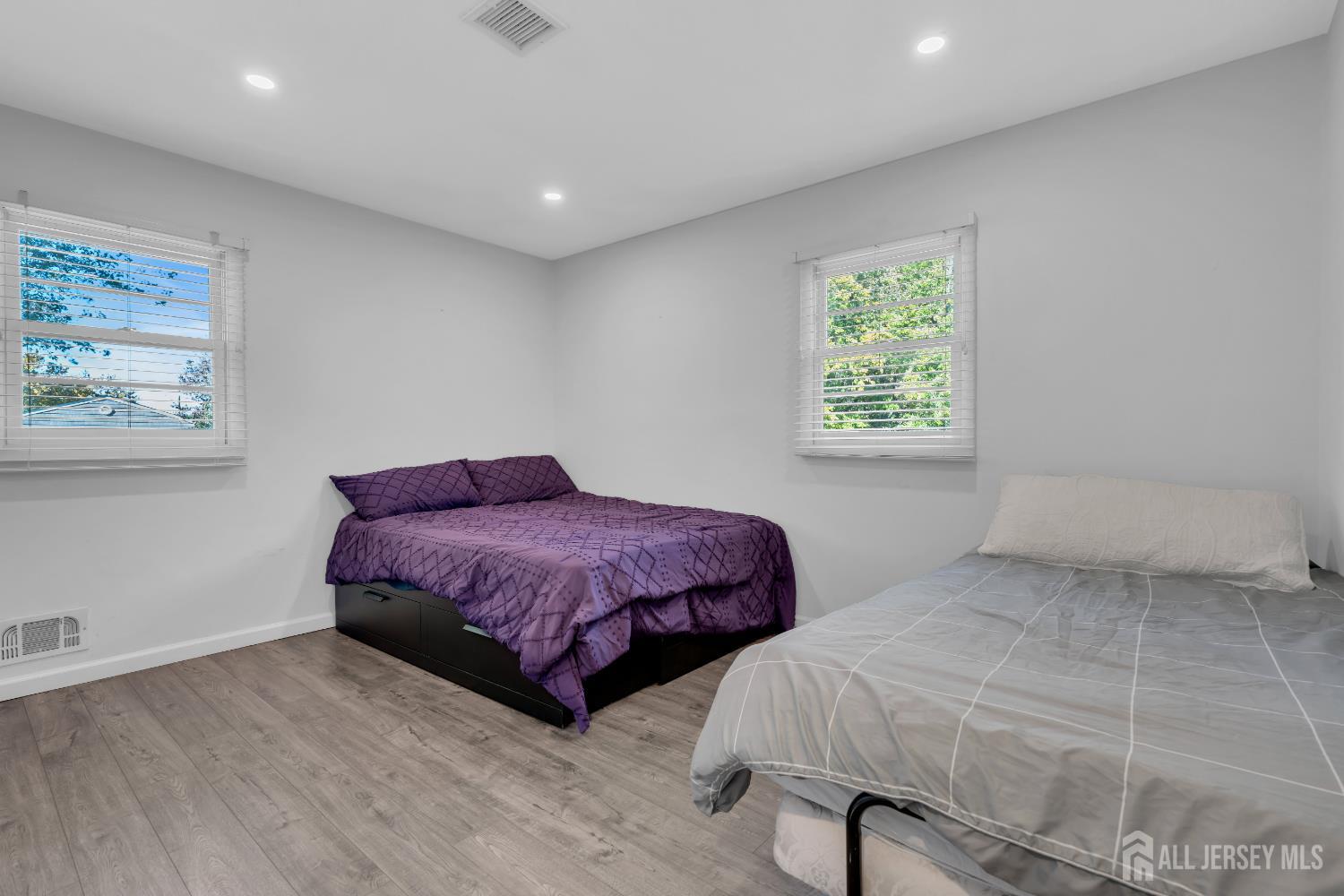 4 Canadian Woods Road Marlboro, NJ 07746 - Photo 22 of 45 a spacious bedroom with a bed and a window