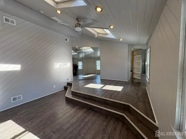a room with pool table and a chandelier