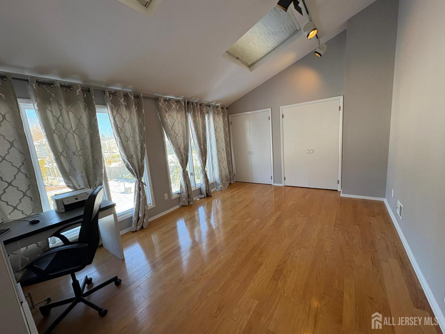 4 Canadian Woods Road Marlboro, NJ 07746 - Photo 34 of 45 wooden floor in an empty room with a window
