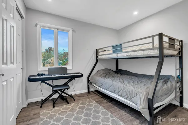 a bedroom with a bed and a table