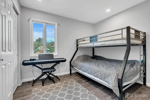 a bedroom with a bed and a table