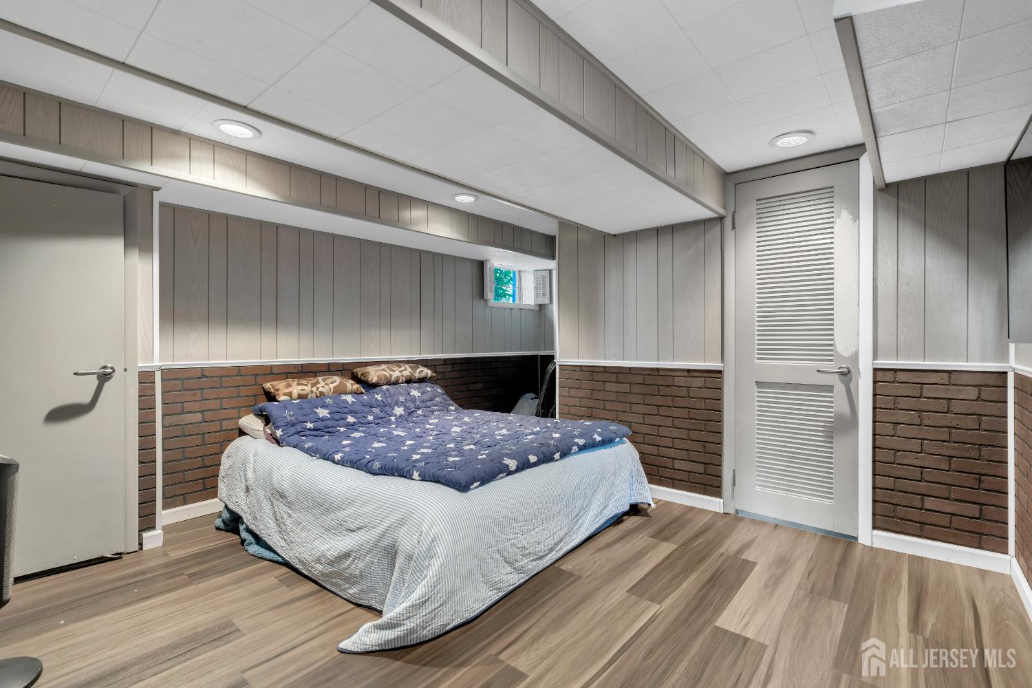 4 Canadian Woods Road Marlboro, NJ 07746 - Photo 39 of 45 a bedroom with a bed and a window