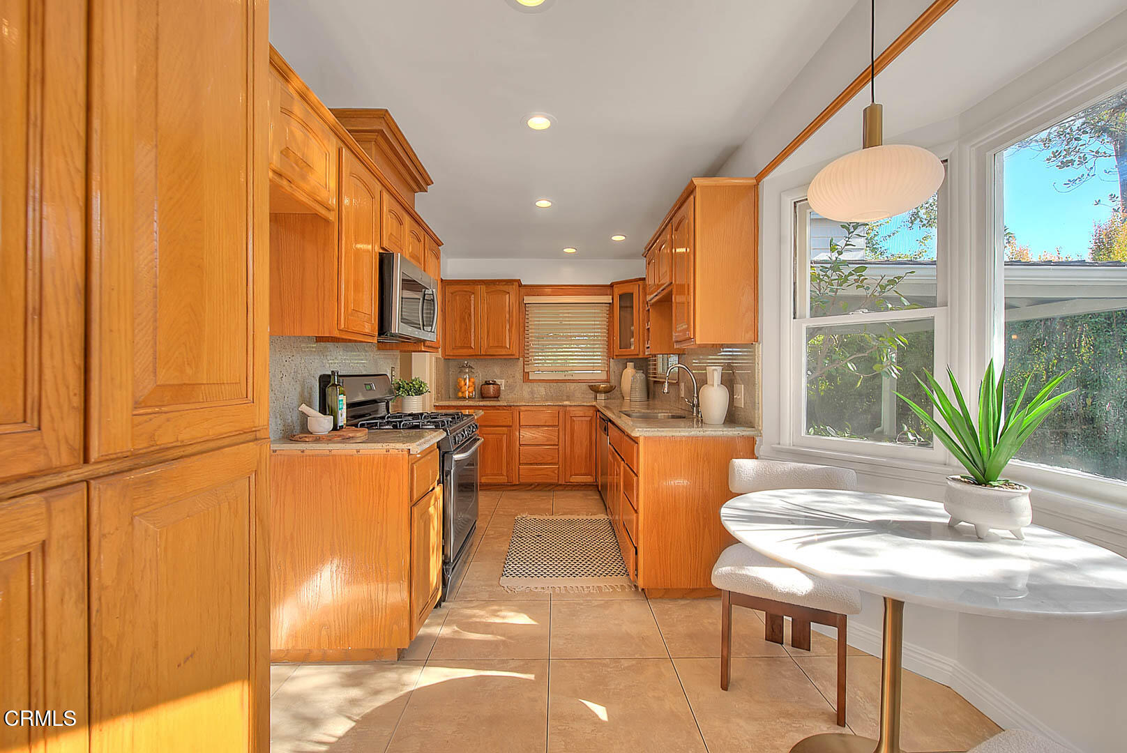 3671 Grayburn Road Pasadena, CA 91107 - Photo 12 of 50 a kitchen with stainless steel appliances granite countertop a refrigerator a sink a stove and island