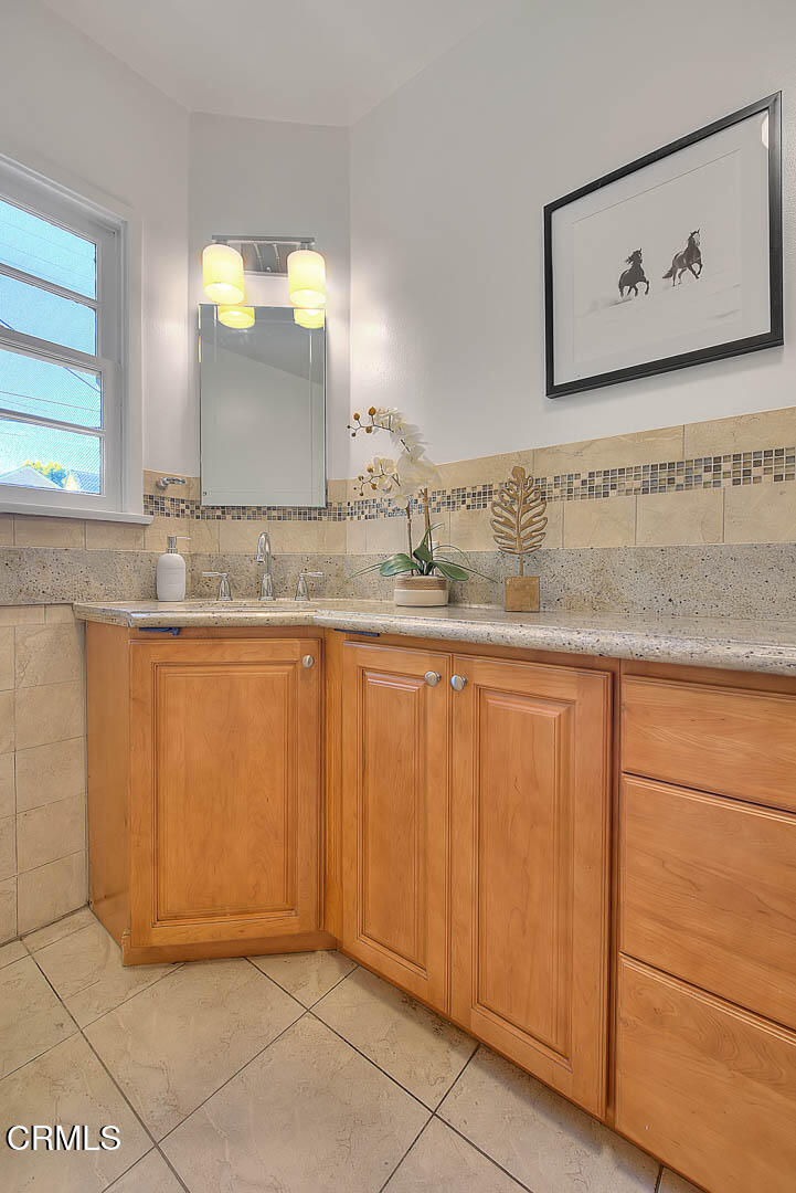 3671 Grayburn Road Pasadena, CA 91107 - Photo 26 of 50 a bathroom with a sink and a mirror