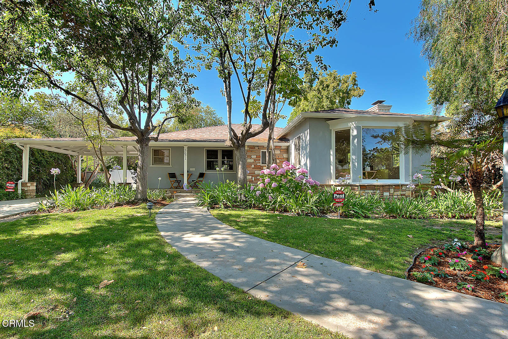 3671 Grayburn Road Pasadena, CA 91107 - Photo 49 of 50 a front view of a house with a garden