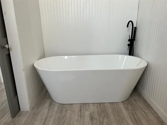 a view of a bathtub in a bathroom