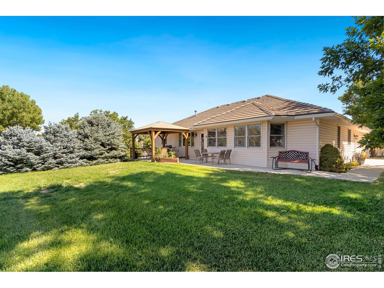7848 Windsong Road Windsor, CO 80550 - Photo 25 of 37 Back of home