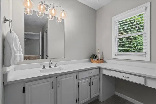 a bathroom with a sink double vanity and a mirror