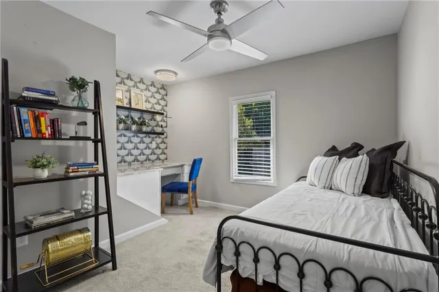 a bed room with a bed and a chair