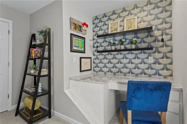 a kitchen with a sink a stove and a wooden floor