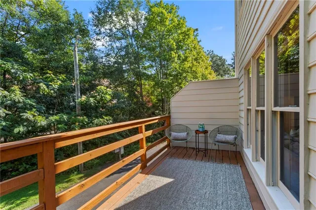a view of balcony with furniture