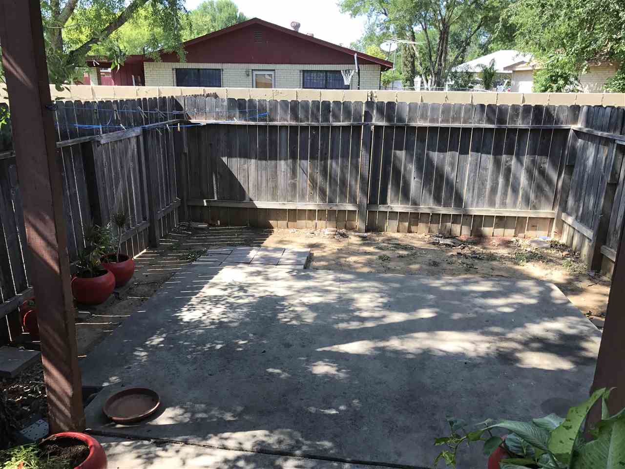 1300 Hillside Road, Unit 11 Laredo, TX 78041 - Photo 9 of 13 a view of a backyard with wooden fence