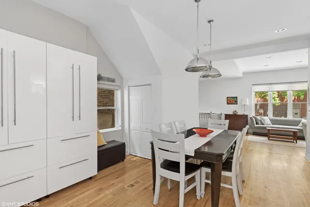 a view of a dining room with furniture window and wooden floor